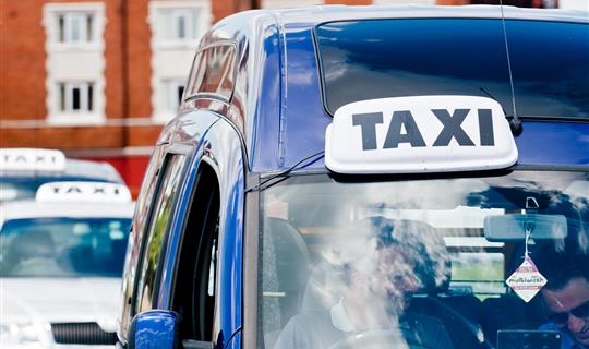 Taxi driver driving passenger to correct destination